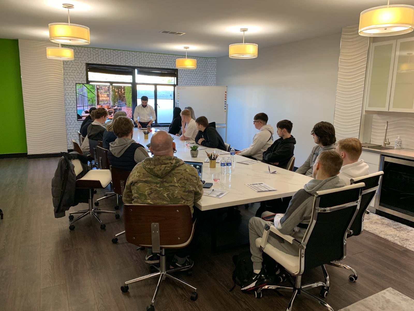 IVOLO students and a mentor around a boardroom table during a Turing Scheme placement in Silicon Valley
